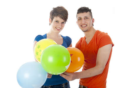 happy couple with colorful balloons on a white backgroundの写真素材