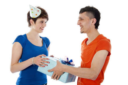 a happy boy is having a present for his birthday girl on a white backgroundの写真素材