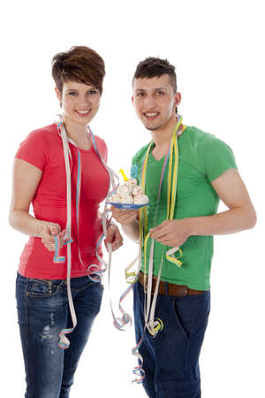 a boy and a girl with balloons and a birthdaycakeの写真素材