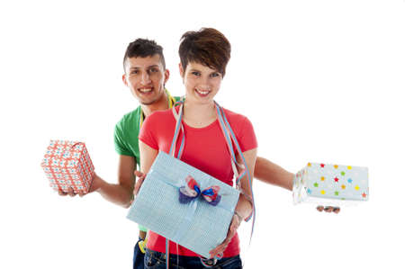 a birthdayboy and a birthdaygirl with a lot of presents an a birthdaycakeの写真素材