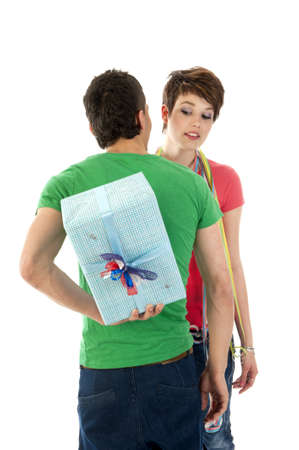 a boy with a secret present for his birtdaygirl!の写真素材