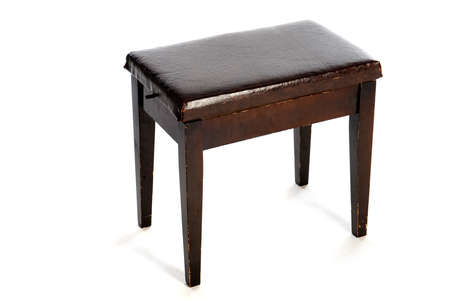 an old piano stool on a white backgroundの写真素材