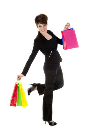 a girl with a lot of shopping bags in all kind of colorsの写真素材