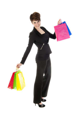 a girl with a lot of shopping bags in all kind of colorsの写真素材