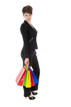 a girl with a lot of shopping bags in all kind of colorsの写真素材