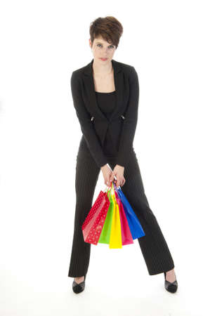 a girl with a lot of shopping bags in all kind of colorsの写真素材