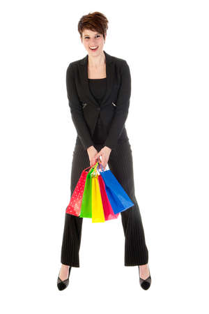 a girl with a lot of shopping bags in all kind of colorsの写真素材