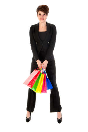 a girl with a lot of shopping bags in all kind of colorsの写真素材