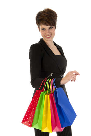 a girl with a lot of shopping bags in all kind of colorsの写真素材