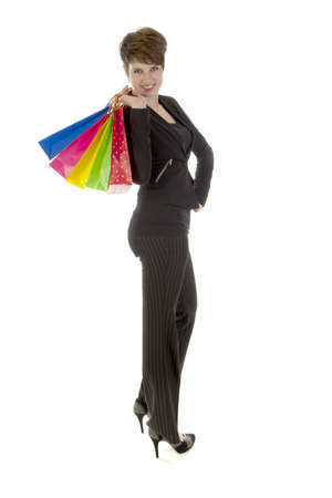 a girl with a lot of shopping bags in all kind of colorsの写真素材
