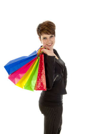 a girl with a lot of shopping bags in all kind of colorsの写真素材