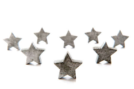 silver stars for christmas in a row on a white backgroundの写真素材