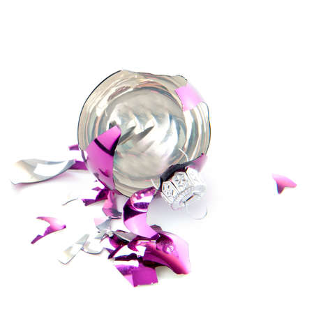 a broken christmas ball on a white backgroundの写真素材