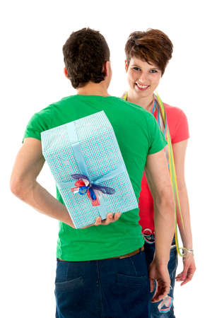 a boy with a secret present for his birtdaygirl!の写真素材