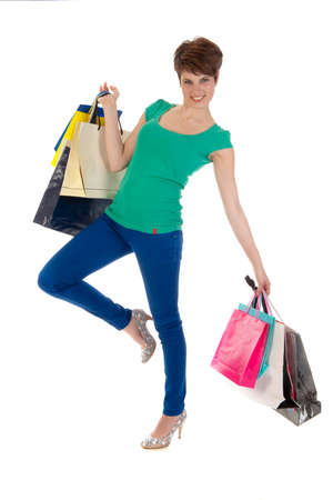 a young women with a lot of shoppingbagsの写真素材