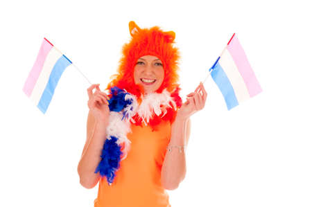 a girl, dressed in orange as a supporter of the dutch soccerteam の写真素材