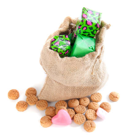 A jute bag with presents, for celebrating the dutch holiday   sinterklaas   on the fifth of Decemberの写真素材