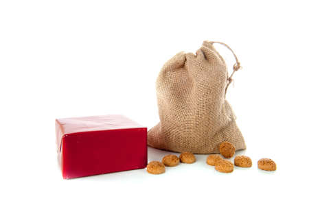 A jute bag full of pepernoten, for celebrating a dutch holiday " Sinterklaas "  on the fifth of Decemberの写真素材
