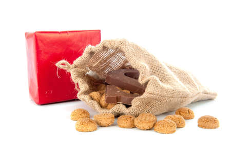 A jute bag full of pepernoten, for celebrating a dutch holiday " Sinterklaas "  on the fifth of Decemberの写真素材