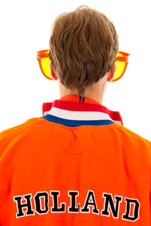 the back of  a supporter of the dutch soccer teamの写真素材