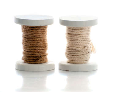 two spools of rope on a white backgroundの写真素材