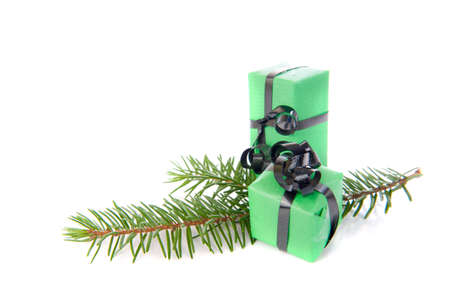 Christmas presents in green on a white backgroundの写真素材