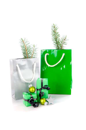 Christmas presents in green on a white の写真素材