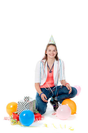 a birthday girl with presents and balloonsの写真素材