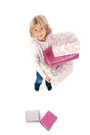 a little boy with a lot of presents on a white backgroundの写真素材