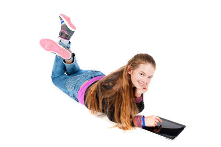 a beautiful young and modern girl with a tablet の写真素材