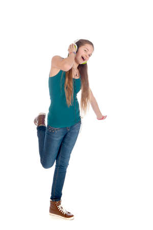 a happy teenager, listen to some music, on a white backgroundの写真素材