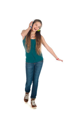 a happy teenager, listen to some music, on a white backgroundの写真素材