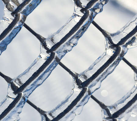Ice covered chain link fence from a severe ice storm 