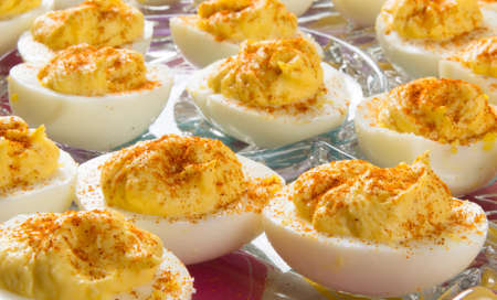 Several Deviled Eggs topped with paprikaの写真素材