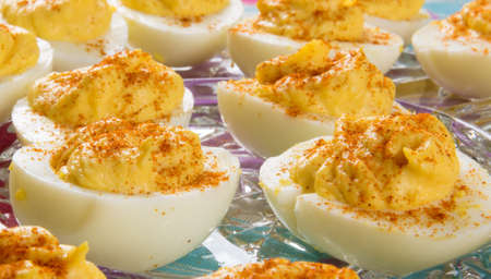 Several Deviled Eggs topped with paprikaの写真素材