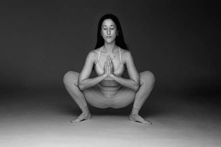 Woman doing a Yoga pose. black and white photoの写真素材