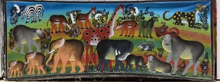 original african paintings in a souvenirs shop at zanzibar islandの写真素材