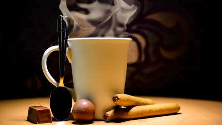 A warm cup of tea and chocolateの写真素材