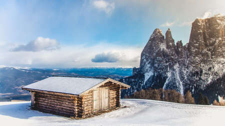 A wooden house at the mountainの写真素材