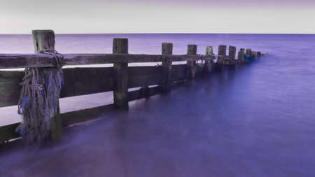 Fence in oceanの写真素材