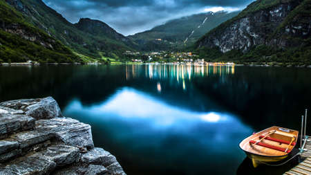 Village lake and a boatの写真素材