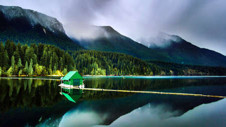 Green house on lakeの写真素材