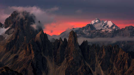 Red sunset in the mountains peaksの写真素材