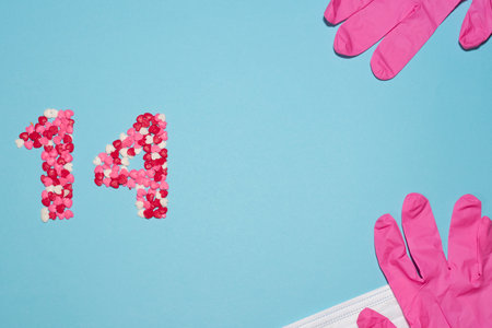 Hearts for February 14, Valentine's Day, with mask and pink gloves, biosecurity protection.の写真素材