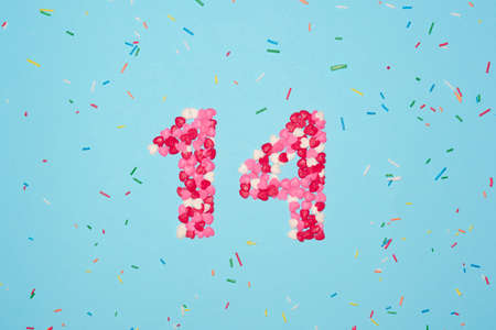 Confetti February 14, for Valentine's Day, hearts and colors on a light blue background.の写真素材