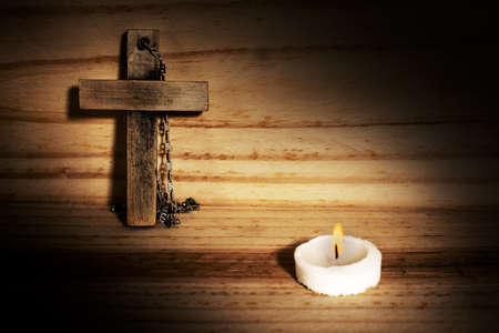 cross in wood, candleの写真素材