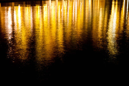 Lights reflection with wavesの写真素材