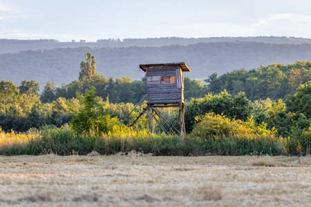 A hunter tower next to a wheat fieldの写真素材