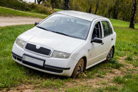 A car got stuck in the muddy grassの写真素材