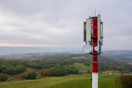 Radio transmitter tower on the edge of a fieldの写真素材